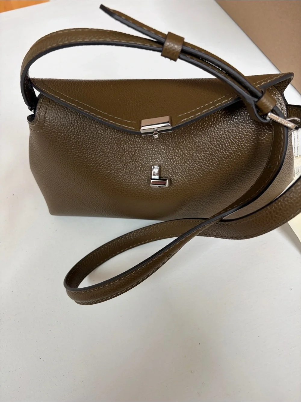 Toteme Dark Taupe  Leather Pebbled Clutch with Silver-Tone T Closure .